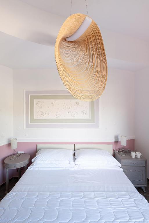 Ein Bett oder Betten in einem Zimmer der Unterkunft Albergo Minerva