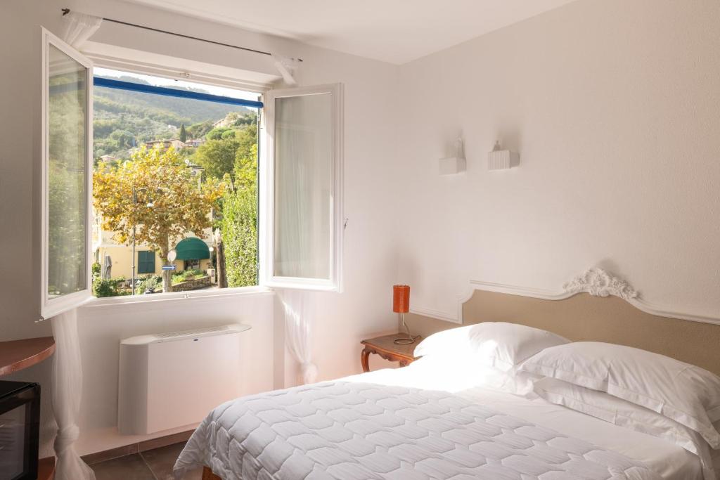 Ein Bett oder Betten in einem Zimmer der Unterkunft Albergo Minerva