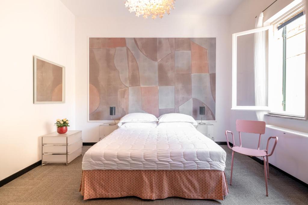 Ein Bett oder Betten in einem Zimmer der Unterkunft Albergo Minerva