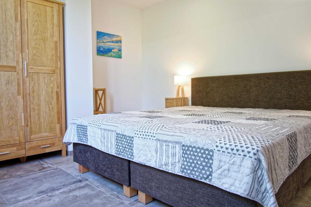 Postel nebo postele na pokoji v ubytování Les Mûriers "Scopa"