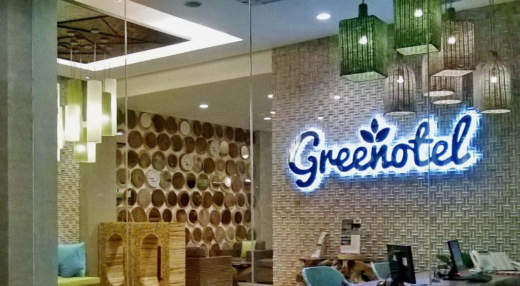 a greenfield sign on the wall of a store at Greenotel Cilegon in Cilegon