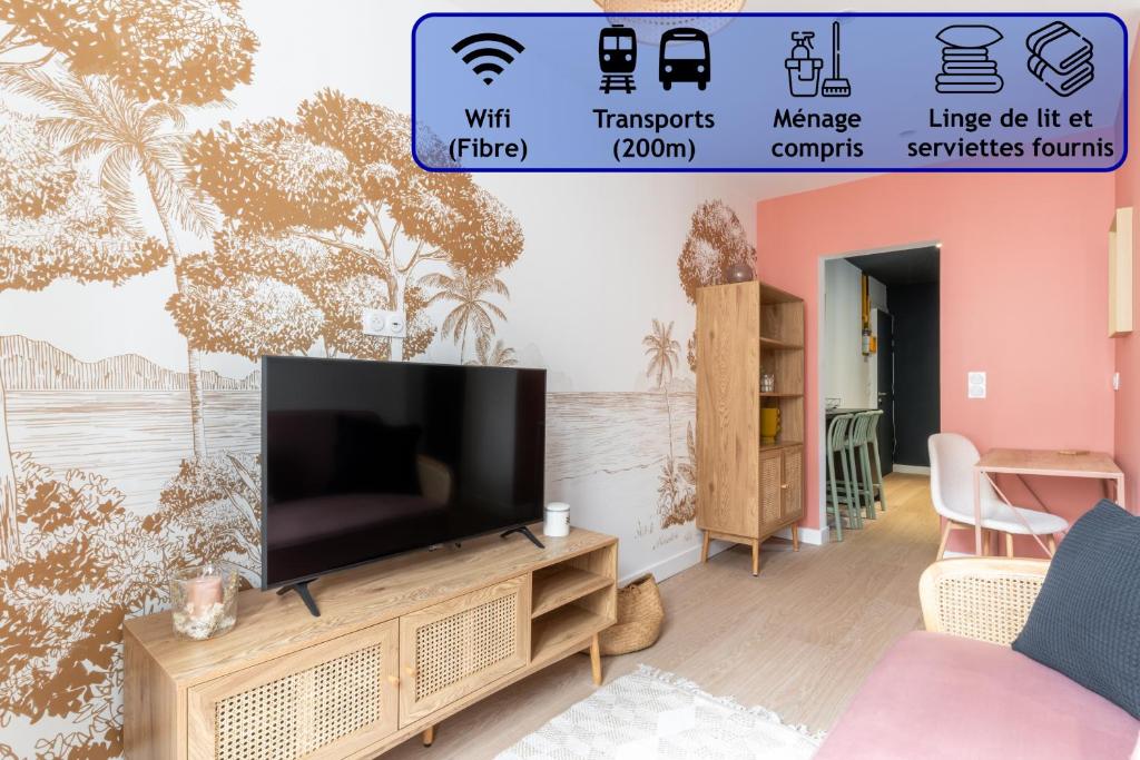a living room with a television on a wall with palm trees at Appartement élégant proche Tramway & Centre-Ville in Nantes