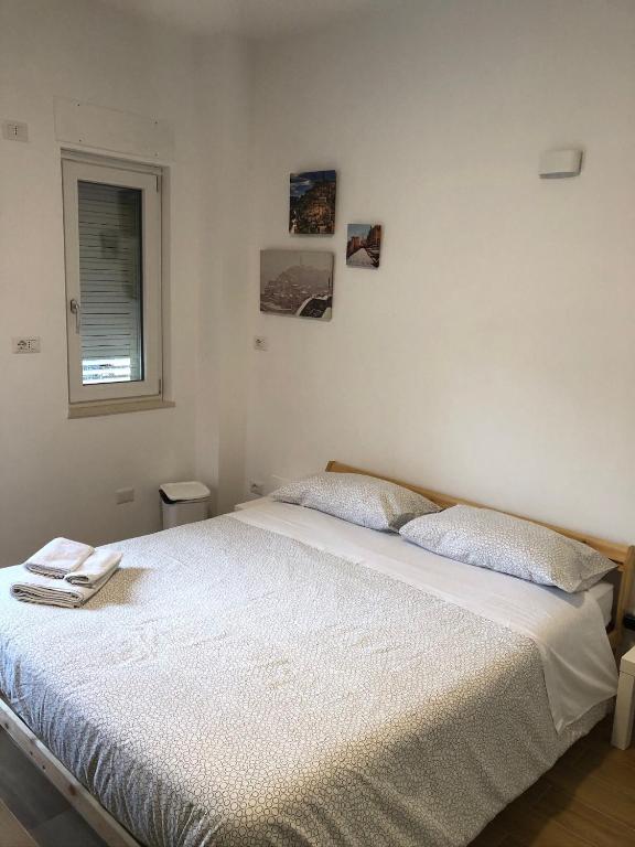 Postel nebo postele na pokoji v ubytování La Dimora di Piccianello 16B