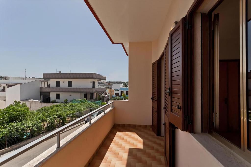 a balcony with a view of a city at Helle Wohnung In Santa Maria Al Bagno in Santa Maria al Bagno