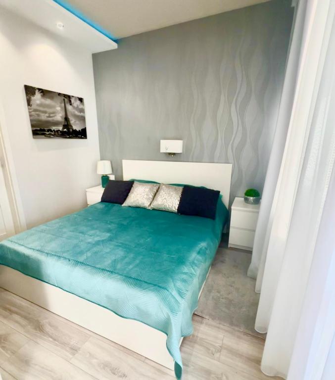 Postel nebo postele na pokoji v ubytování Downtown Dream Apartmans
