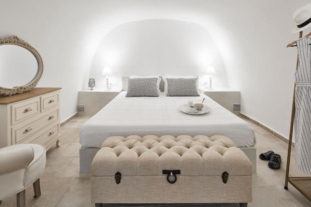A bed or beds in a room at Amaya Sensational Villa Caldera View-Outdoor Hot Tub Oia Santorini