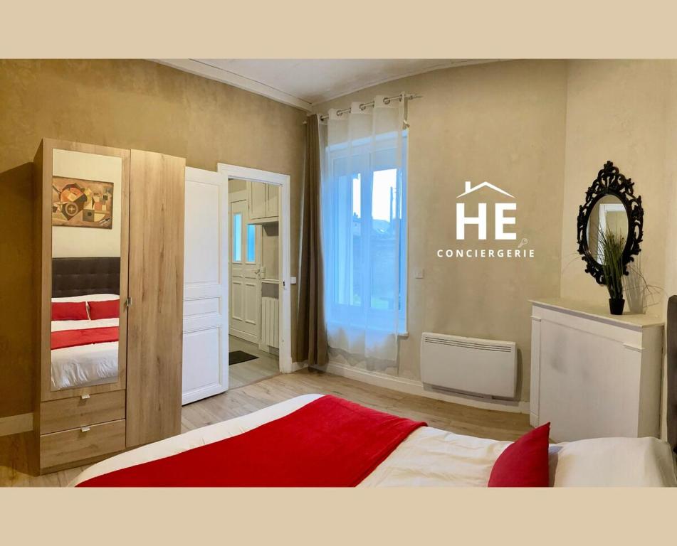 En eller flere senge i et værelse på Room New York Proche Gare 400m