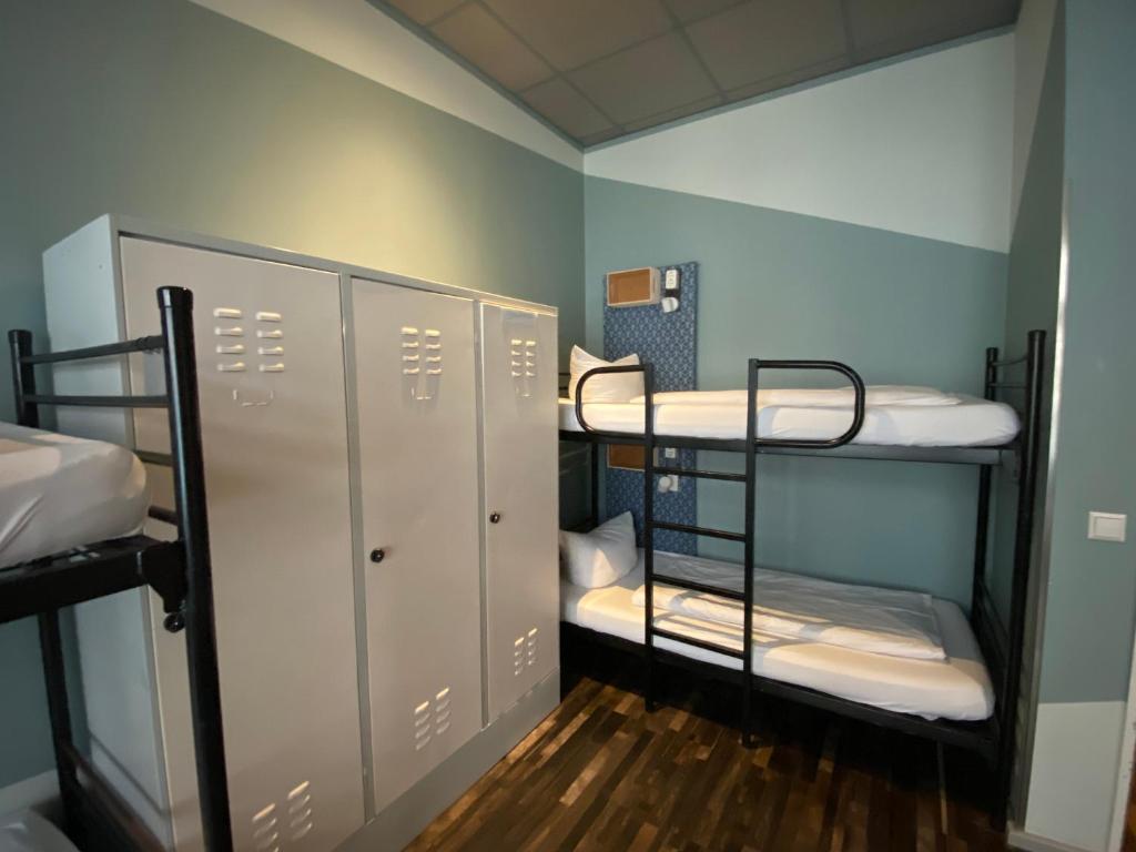 Postel nebo postele na pokoji v ubytování Singer109 Hostel, Hotel & Apartment
