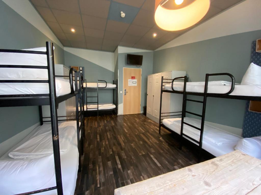 Postel nebo postele na pokoji v ubytování Singer109 Hostel, Hotel & Apartment