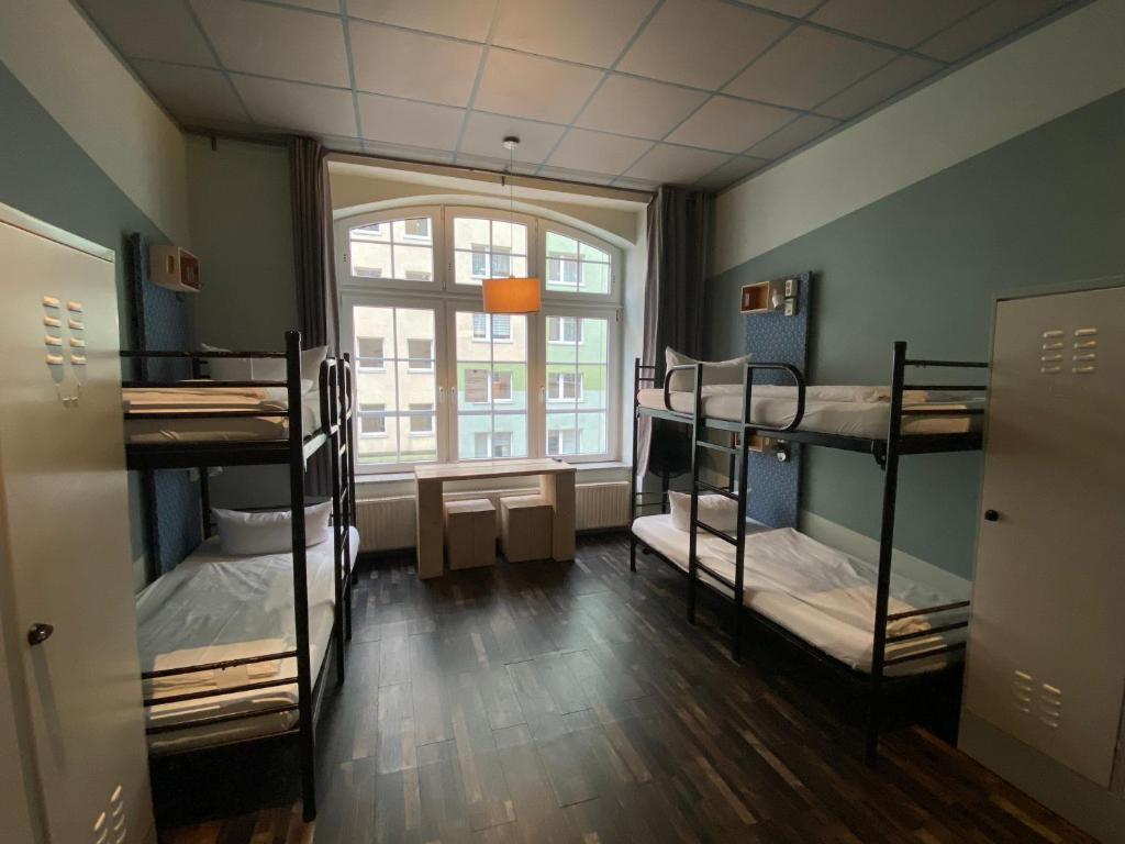 Postel nebo postele na pokoji v ubytování Singer109 Hostel, Hotel & Apartment