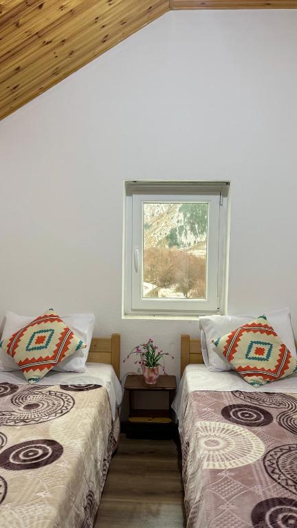 Łóżko lub łóżka w pokoju w obiekcie Guesthouse Makry
