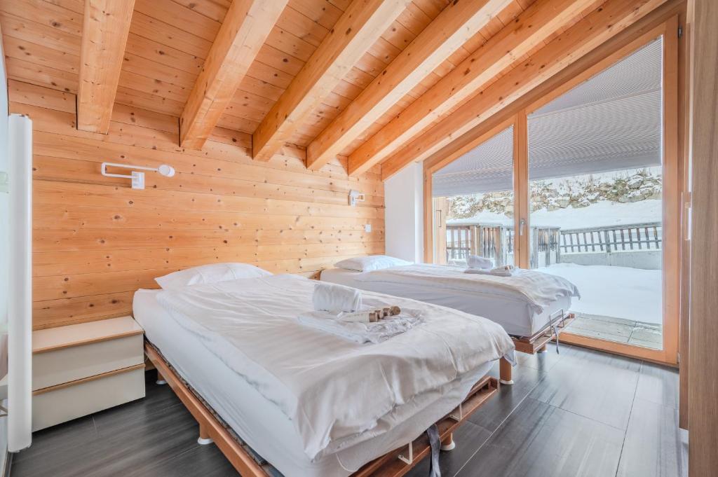 Postel nebo postele na pokoji v ubytování Ski Paradise MOUNTAIN & LUXE apartments