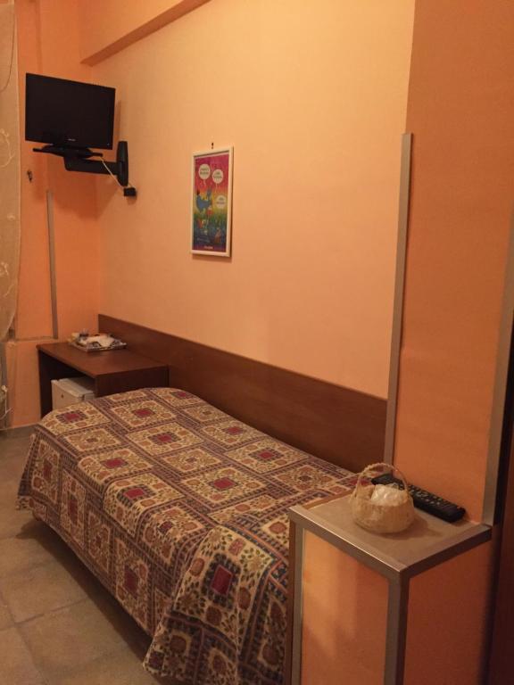Postel nebo postele na pokoji v ubytování Albergo Anna