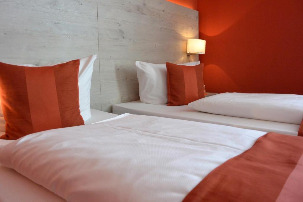 Postel nebo postele na pokoji v ubytování Hotel Schlee
