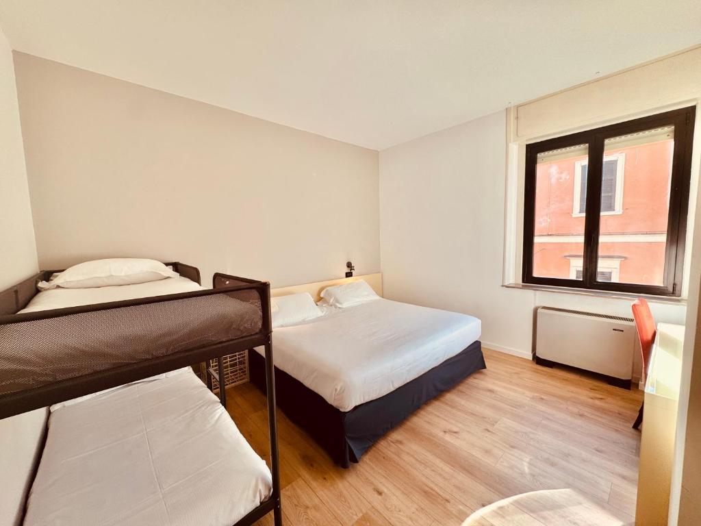 Postel nebo postele na pokoji v ubytování Hotel Pex Mantova