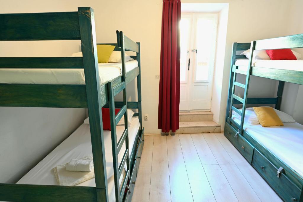 Postel nebo postele na pokoji v ubytování White Rabbit Hostel
