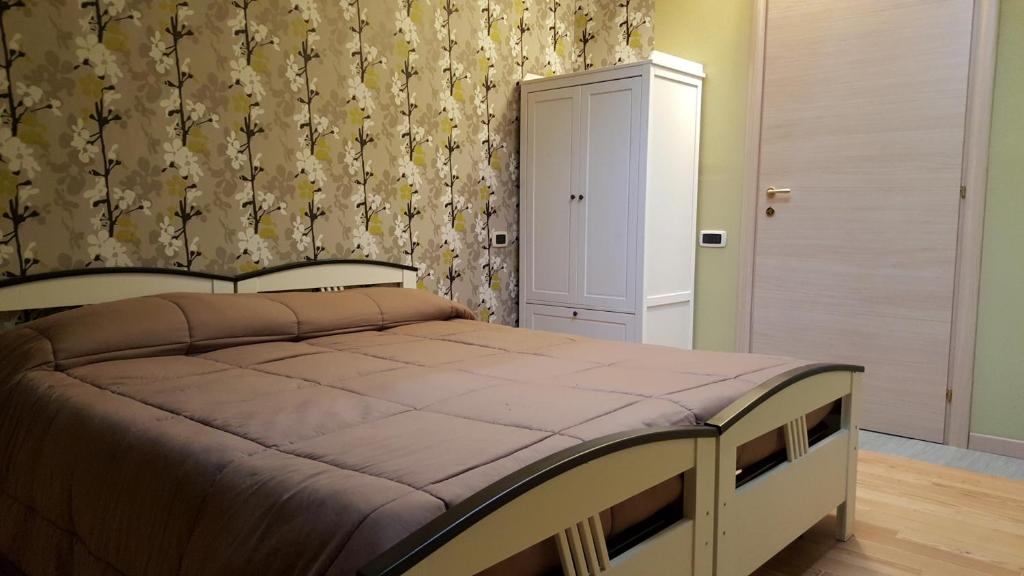 Postel nebo postele na pokoji v ubytování B&B Casa Arcangeli