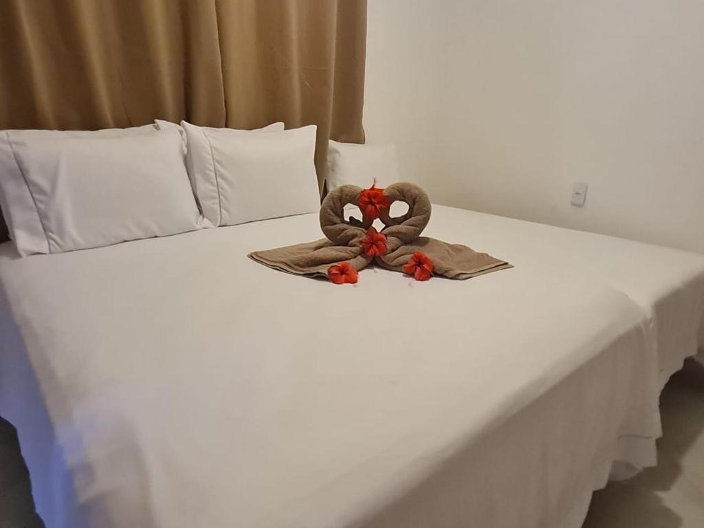 Postel nebo postele na pokoji v ubytování Chalé dos Anjos