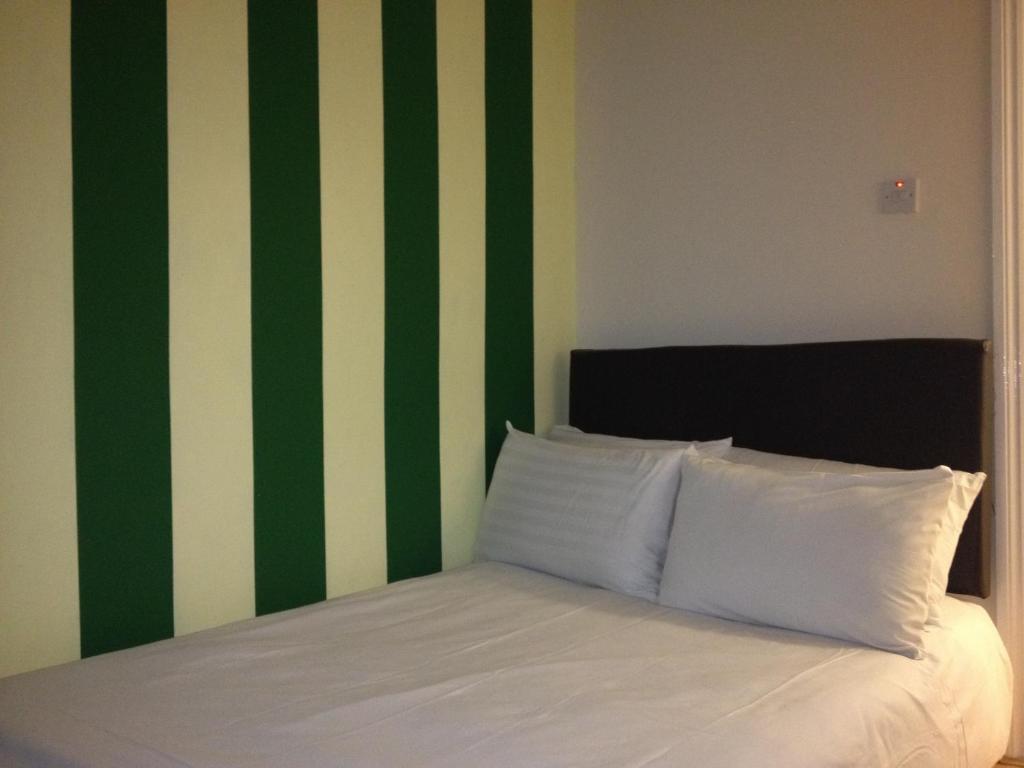 Postel nebo postele na pokoji v ubytování City View Hotel Roman Road