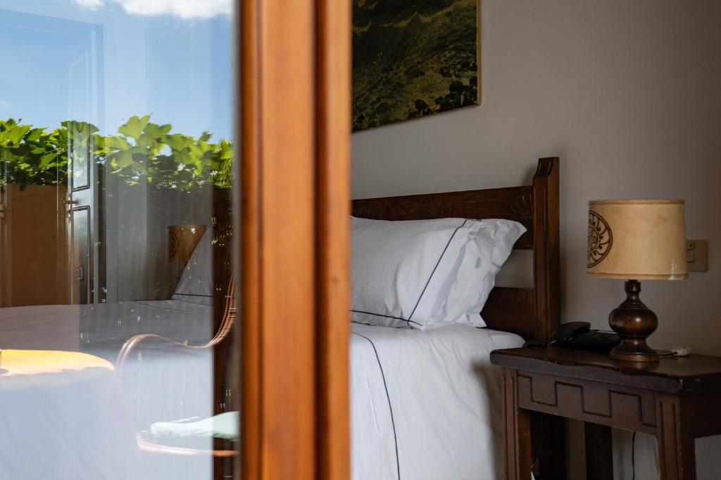 Postel nebo postele na pokoji v ubytování Hotel Carasco
