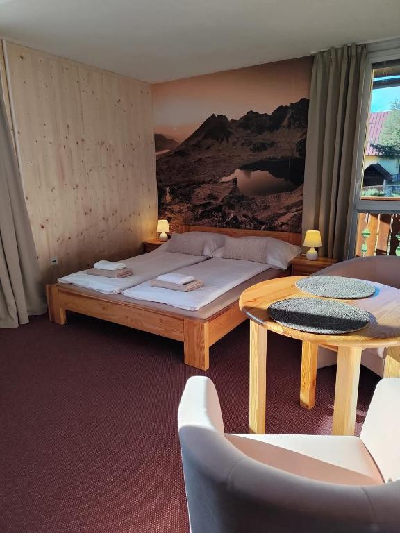 Postel nebo postele na pokoji v ubytování Villa Tatran