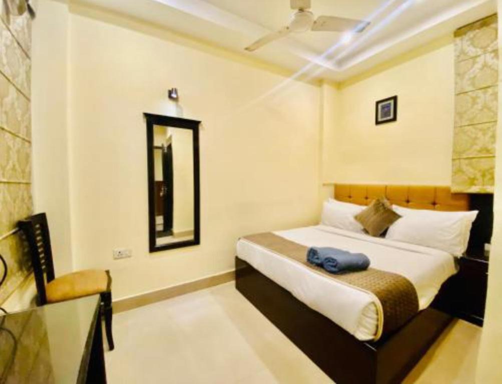 Postel nebo postele na pokoji v ubytování The Reo Lodge, Haridwar