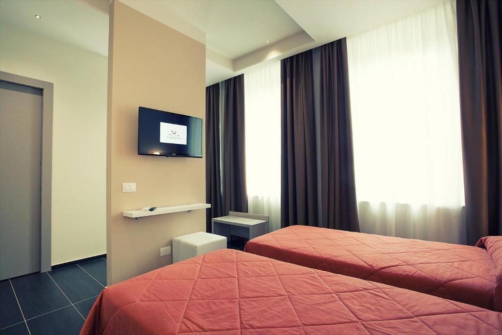 Postel nebo postele na pokoji v ubytování Hotel Agrigento Home
