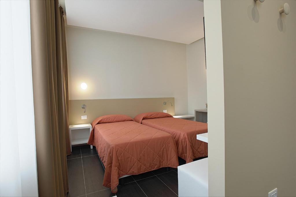 Postel nebo postele na pokoji v ubytování Hotel Agrigento Home