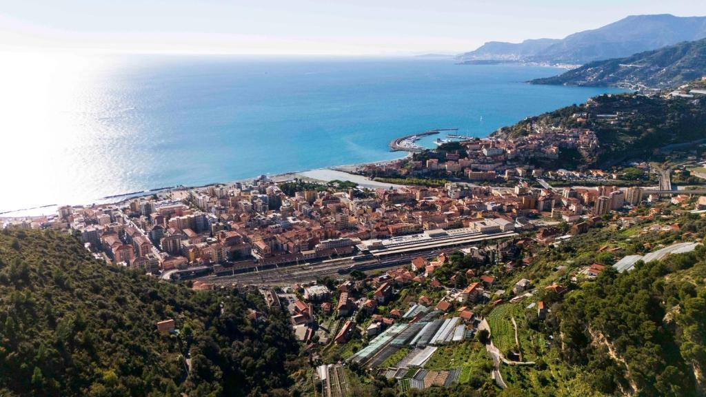 an aerial view of a city next to the ocean at Villa Charlene - Pool, Peace, Jacuzzi and Ligurian Views in Ventimiglia