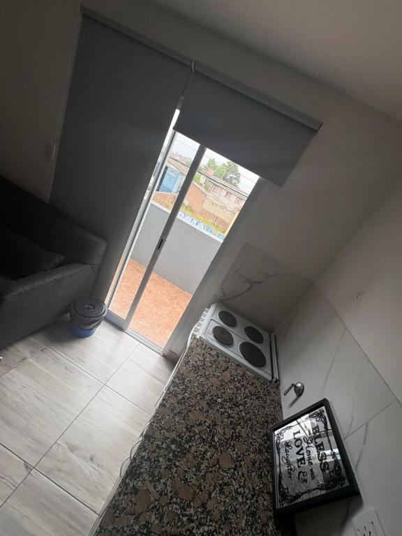 an overhead view of a living room with a window at Apartamentos dulce 123 in Necochea