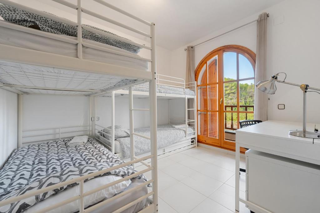 Postel nebo postele na pokoji v ubytování Hauzify I Casa Jaume Soler