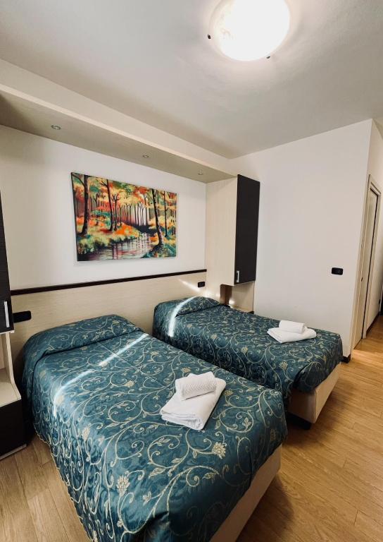 Postel nebo postele na pokoji v ubytování Hotel Al Fogo