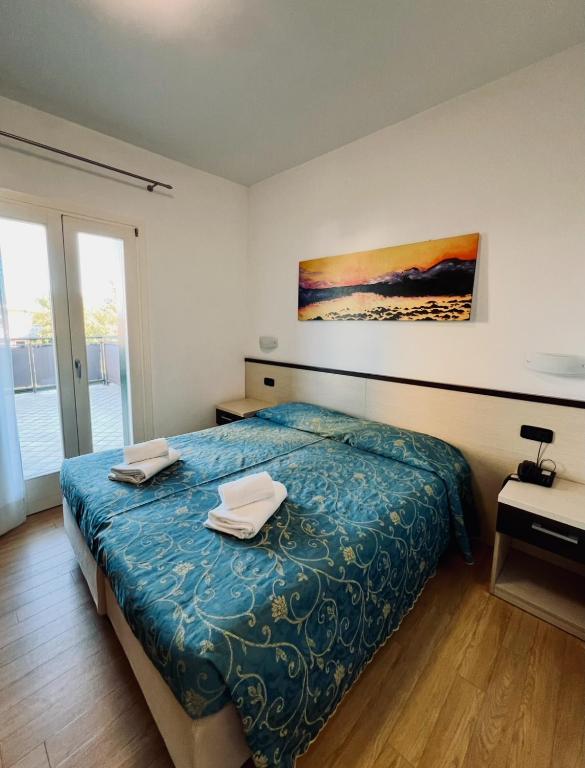 Postel nebo postele na pokoji v ubytování Hotel Al Fogo