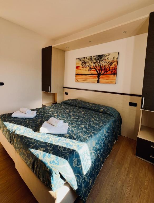 Postel nebo postele na pokoji v ubytování Hotel Al Fogo