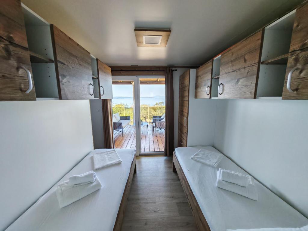 Postel nebo postele na pokoji v ubytování Mobile home Sparkle TT