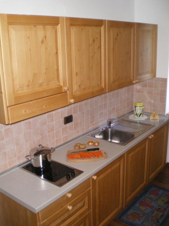 Kuchyň nebo kuchyňský kout v ubytování Hotel Garni Arnica