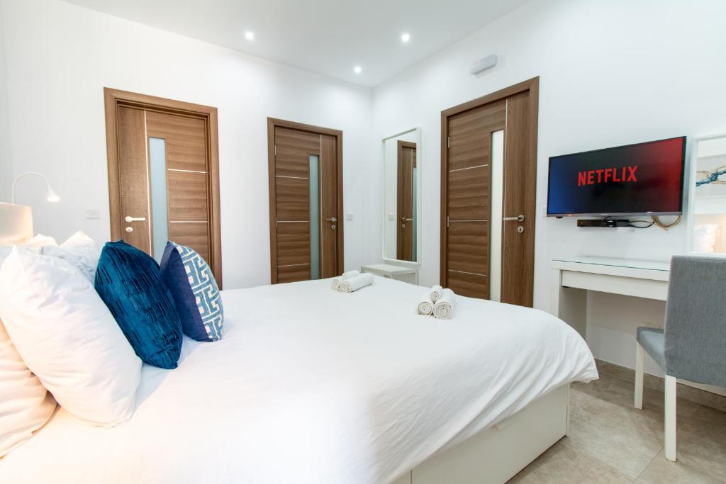 Postel nebo postele na pokoji v ubytování Sandstone Apartment 17