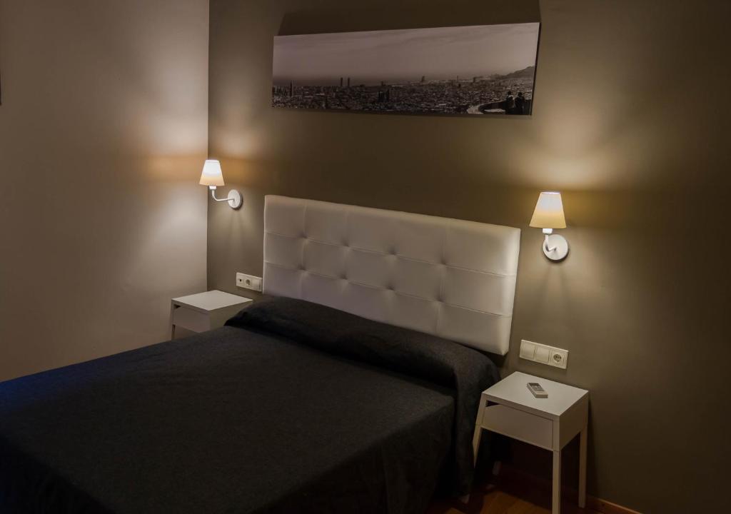 Postel nebo postele na pokoji v ubytování Hostal Sant Pau