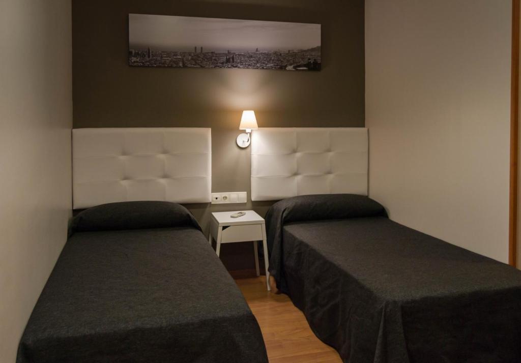 Postel nebo postele na pokoji v ubytování Hostal Sant Pau