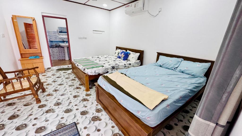 Postel nebo postele na pokoji v ubytování Thurai guest house 2