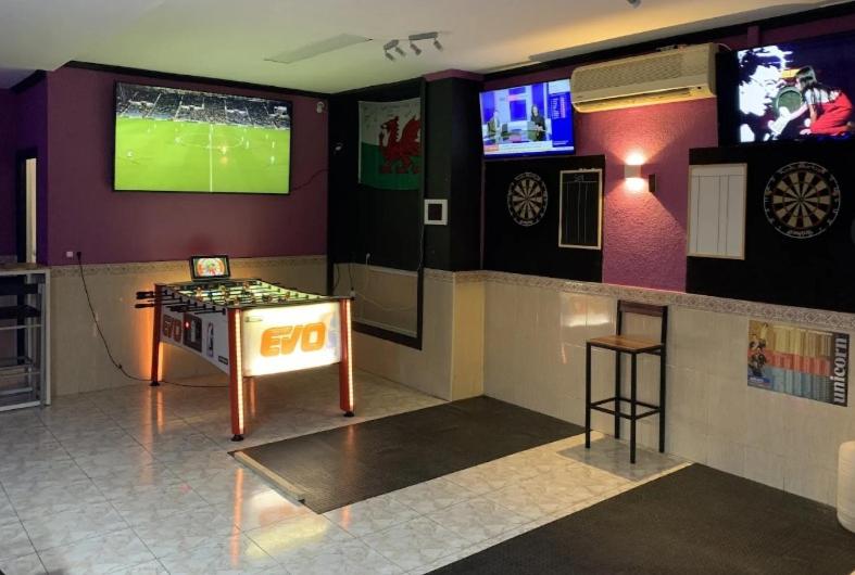 TV a/nebo společenská místnost v ubytování ARENAL GOLF HOME