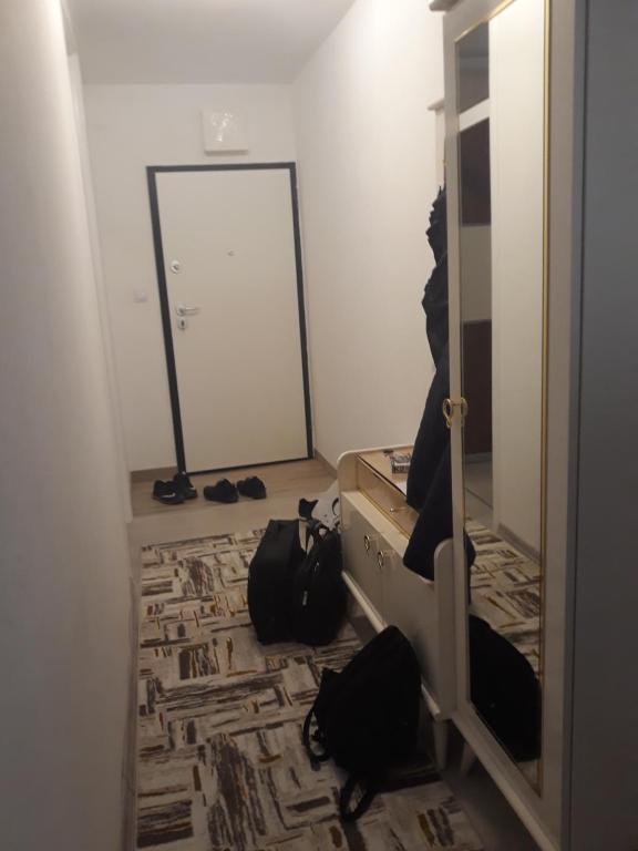 a person sitting in front of a mirror in a room at Alen in Velika Kladuša