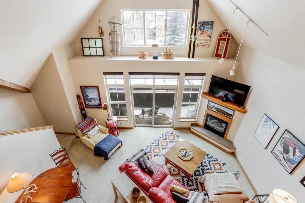an overhead view of a living room with a couch and a tv at Cozy, Comfy and Convenient in Frisco