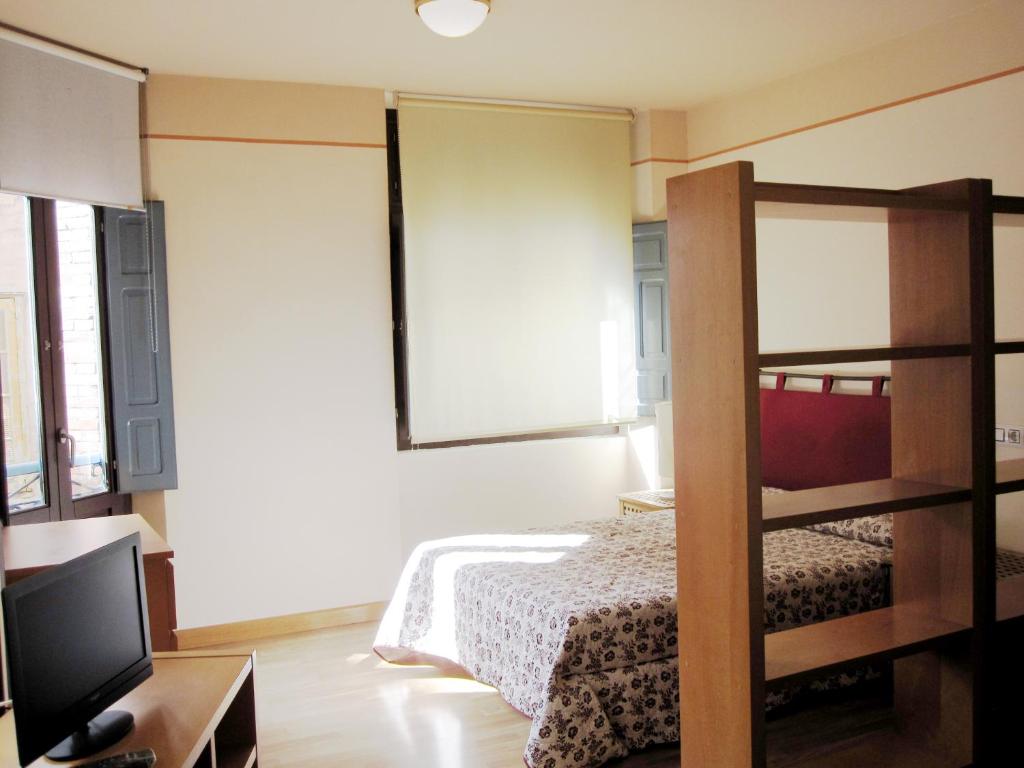 Postel nebo postele na pokoji v ubytování Apartamentos Legazpi