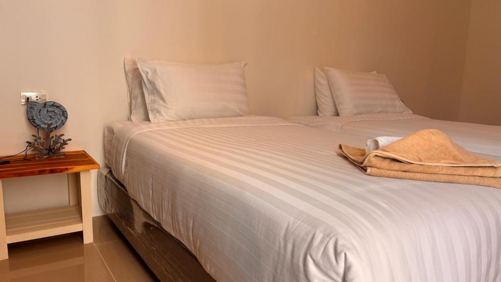 Postel nebo postele na pokoji v ubytování PP Blue Sky Resort-SHA Plus