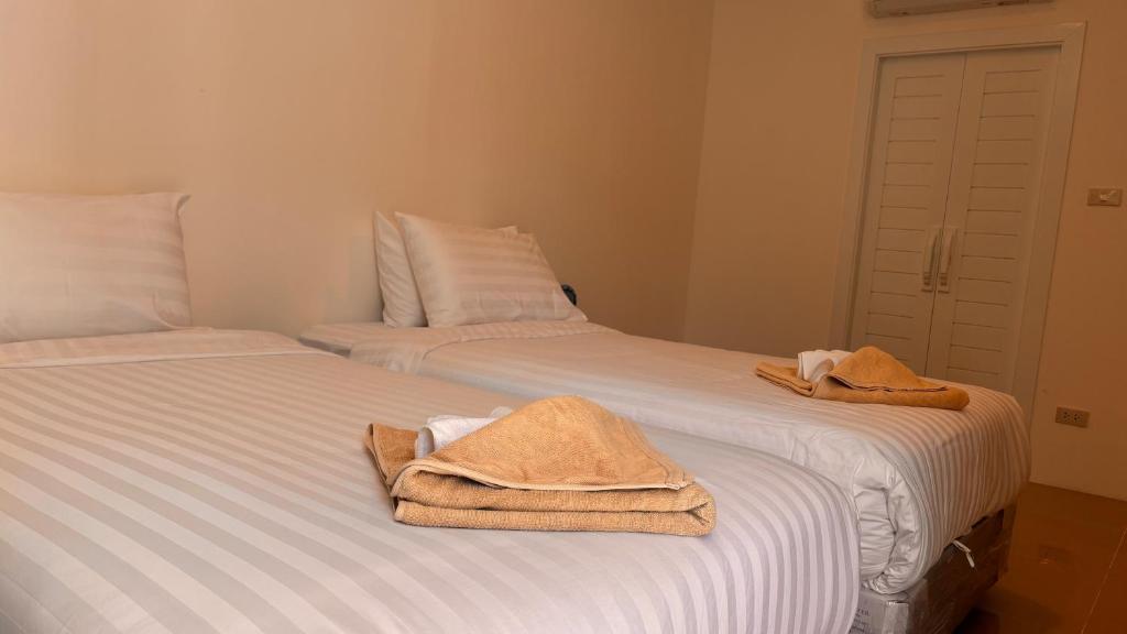Postel nebo postele na pokoji v ubytování PP Blue Sky Resort-SHA Plus