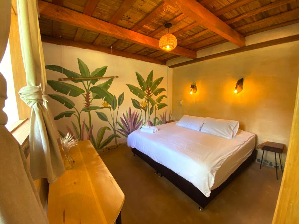 Postel nebo postele na pokoji v ubytování Aracari Ecolodge