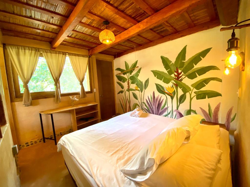 Postel nebo postele na pokoji v ubytování Aracari Ecolodge