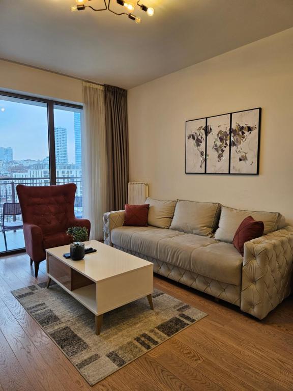a living room with a couch and a coffee table at Best Apartments-Aqua-Belgrade Waterfront in Belgrade