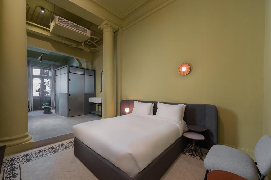 Postel nebo postele na pokoji v ubytování grey l studio apartments Corniche Alexandria